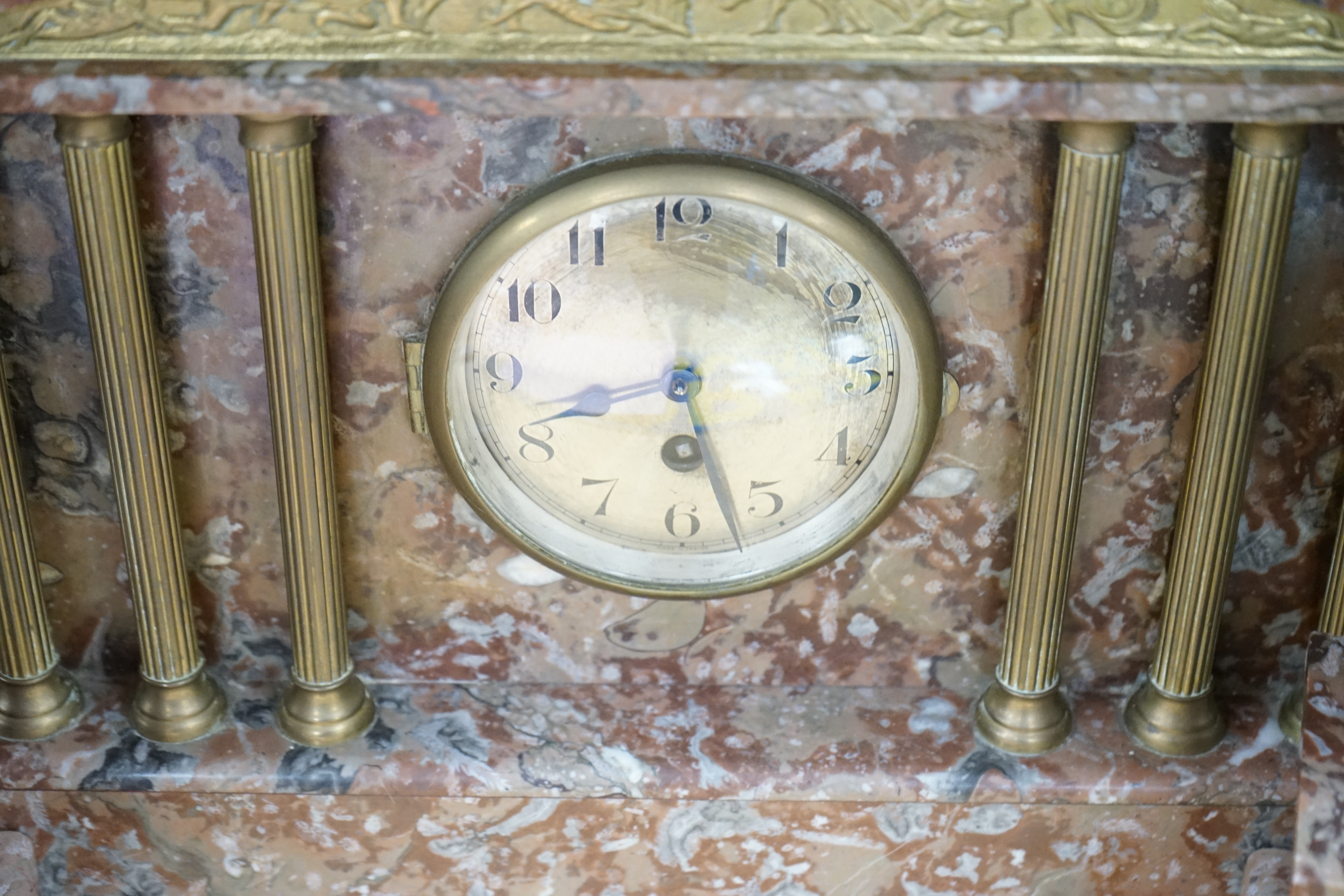 A Victorian rouge marble clock garniture, 30.5cm high. Condition - fair to good